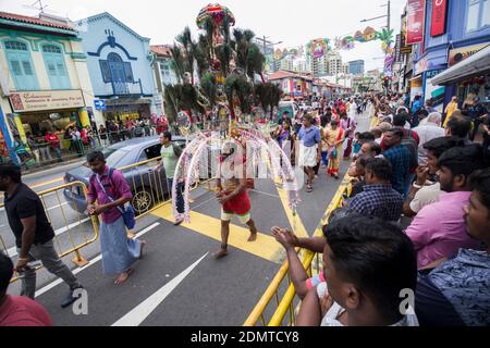 Singapore: penitent attending the Thaipusam Cavadee (or Thaipoosam Festival) in Serangoon Street, district of Little India Stock Photo