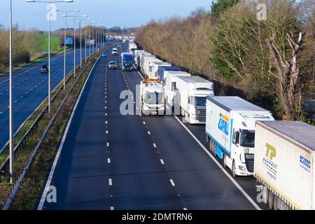 Westerhanger, Kent, UK. 17th Dec, 2020. Delays on the M20 with miles of lorry queues parked on the hard shoulder from exit 11 and further into Dover as traffic builds up due to the Dover TAP (Traffic Access Protocol). There are also delays of up to two and a half hours on ferries between Dover and Calais due to congestion. Photo Credit: Paul Lawrenson-PAL Media/Alamy Live News Stock Photo