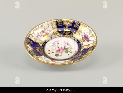 Dish with Imari Pattern, hard paste porcelain, vitreous enamel, gold, Dish with segmented decoration of gilt and enamel florals on alternating white and blue ground. At center, a white ground medallion with pink flowers. Gilding at rim., England, after 1833, ceramics, Decorative Arts, dish, dish Stock Photo