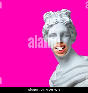 Collage with plaster head model, statue and female portrait isolated on pink background. Negative space to insert your text. Modern design. Contemporary colorful and conceptual bright art collage. Stockfoto