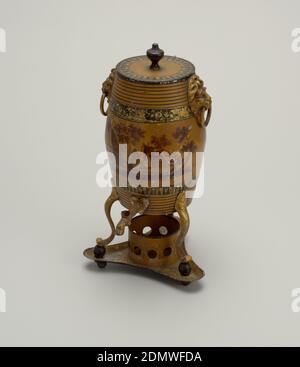 Coffeepot and stand, Enameled tôle, a) Barrel-shaped coffee pot, standing vertically on cabriole legs with ball feet; b) flat cover with urn shaped knob; ring handles held in lion-mark plates; faucet in bottom. Triangular stand, c) concave sides, with circular holder for heating arrangement. Brown, with decoration in dark brown, black and gilt., England, ca. 1800, metalwork, Decorative Arts, Coffeepot and stand Stock Photo