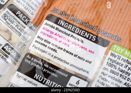 Close-up food nutrition / dietary label on plastic wrapped ASDA unsalted own-brand peanuts. For food allergens topic, & general food information. Stock Photo