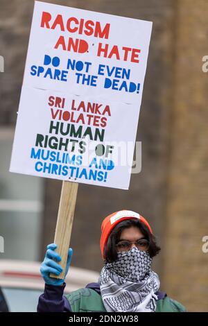 Protester with placard during protest against forced cremation of COVID-19 victims in Sri Lanka, Embassy of Sri Lanka, London, 12 December 2020 Stock Photo