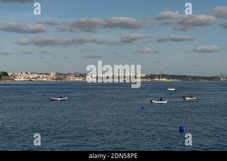 Setubal, Portugal - 17 December, 2020: fisherman checking his traps and catching octopus near Setubal on the Sado River Estuary Stock Photo