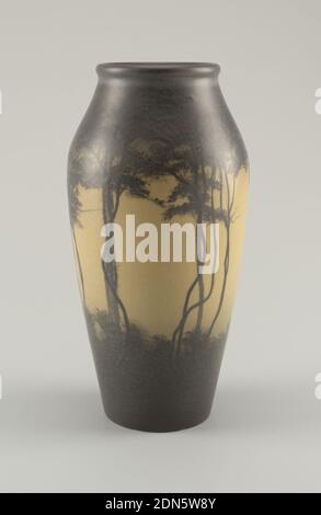 Vase, Rookwood Pottery, American, 1880 - 1967, glazed stoneware, White clay body, thrown. Ovoid body with a gradual taper from shoulder to rim, thick lip; no foot. Decorated with tall slender trees and branches. Underbrush covering lower third of body and tree foliage filling third to lip. Trees and foliage in dark brown underglazed slip against ivory background. Interior is greenish-white, glazed. Allover vellum glaze, crackled. Bottom glazed., 1909, ceramics, Decorative Arts, vase, vase Stock Photo