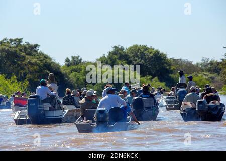 Tourists on boats looking for jaguars on the Três Irmãos River, Pantanal of Mato Grosso, Brazil Stock Photo