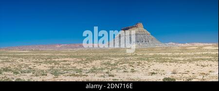 'Factory butte' hill in utah during a sunny day with blue sky Stock Photo