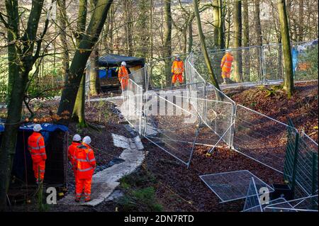 Aylesbury Vale, Buckinghamshire, UK. 17th December, 2020. HS2 were putting in place yet more high security fencing today around part of the anicent woodlands of Jones Hill Wood to keep out anti HS2 protesters who are living in the other part of the woodlands trying to stop HS2 destruction. Leigh Day solicitors wrote a second letter to HS2 Ltd in October to call for a halt to works at Jones Hill Wood since the discovery of Barbastelle bats at the location, however, HS2 contractors remain active at the site. The controversial and over budget High Speed Rail link from London to Birmingham puts HS Stock Photo