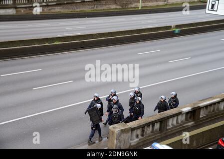 Police forces gather nearby Porte de Vincennes, east of Paris, after at least one person was injured when a gunman opened fire at a kosher grocery store on January 9, 2015 and took at least five people hostage. The attacker was suspected of being the same gunman who killed a policewoman in a shooting in Montrouge in southern Paris, France on January 8. Photo by Nicolas Briquet/ABACAPRESS.COM Stock Photo