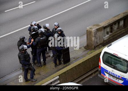 Police forces gather nearby Porte de Vincennes, east of Paris, after at least one person was injured when a gunman opened fire at a kosher grocery store on January 9, 2015 and took at least five people hostage. The attacker was suspected of being the same gunman who killed a policewoman in a shooting in Montrouge in southern Paris, France on January 8. Photo by Nicolas Briquet/ABACAPRESS.COM Stock Photo