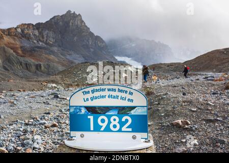 Interpretive sign showing glacier receding at the Athabasca Glacier, Jasper National Park, Alberta, Canada Stock Photo