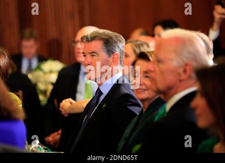 Pierce Brosnan, Representative Nancy Pelosi, and Vice President Joseph Biden jr enjoy the music at a St. Patrick's Day lunch at the United States Capitol. Washington, DC, USA, on March 17, 2015. Photo by Dennis Brack/Pool/ABACAPRESS.COM Stock Photo