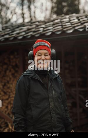 Smiling woman wearing ear protectors Stock Photo