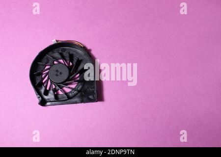 Computer cooler laptop on pink or blue background reont there is a copy of the space. Stock Photo