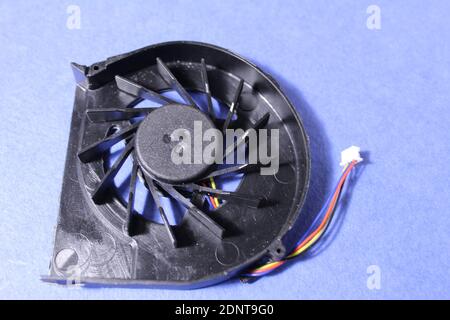 Computer cooler laptop on pink or blue background reont there is a copy of the space. Stock Photo