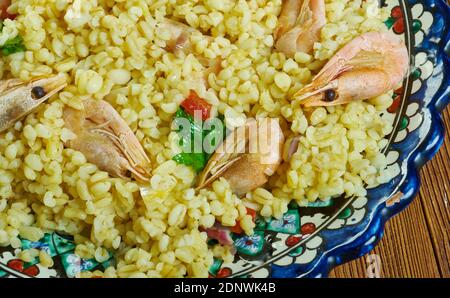 Bulgur di Pesce - Italienischer Bulgur mit Venusmuscheln Stockfoto