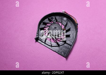 Computer cooler laptop on pink or blue background reont there is a copy of the space. Stock Photo