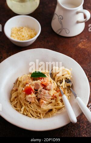 pasta in cream sauce with salmon Stock Photo