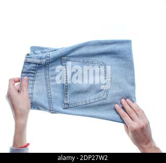 Hände Falten Jeans isoliert auf weißem Hintergrund. Draufsicht. Stockfoto