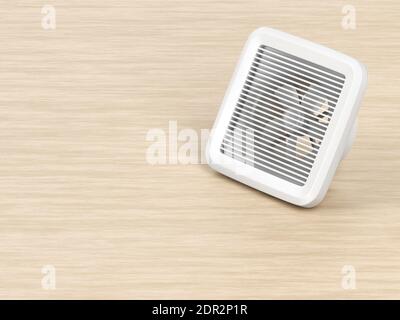 Elektrischer Abluftventilator auf dem Holztisch Stockfoto