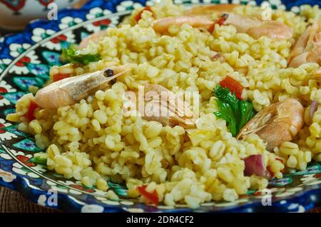 Bulgur di Pesce - Italienischer Bulgur mit Venusmuscheln Stockfoto