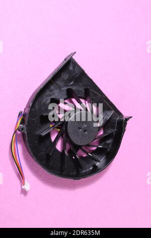 Computer cooler laptop on pink or blue background reont there is a copy of the space. Stock Photo