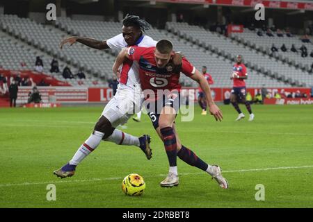 Villeneuve D'Ascq, Frankreich. Dezember 2020. Paris SG Forward MOISE KEAN in Aktion während der französischen Meisterschaft Fußball, Ligue 1 Uber isst, zwischen Lille und Paris Saint Germain im Pierre Mauroy Stadion - Villeneuve d'Ascq.zweite Welle in Frankreich von COVID-19 : Die französische Regierung hat beschlossen, die gesamte Eindämmung und eine Ausgangssperre um 20 Uhr sowie alle Sportereignisse ohne Zuschauer zu spielen, bis auf weiteres Quelle: Pierre Stevenin/ZUMA Wire/Alamy Live News Stockfoto