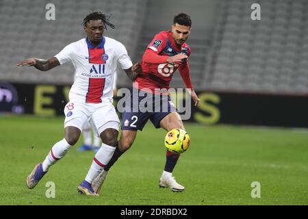 Villeneuve D'Ascq, Frankreich. Dezember 2020. Paris SG Forward MOISE KEAN in Aktion während der französischen Meisterschaft Fußball, Ligue 1 Uber isst, zwischen Lille und Paris Saint Germain im Pierre Mauroy Stadion - Villeneuve d'Ascq.zweite Welle in Frankreich von COVID-19 : Die französische Regierung hat beschlossen, die gesamte Eindämmung und eine Ausgangssperre um 20 Uhr sowie alle Sportereignisse ohne Zuschauer zu spielen, bis auf weiteres Quelle: Pierre Stevenin/ZUMA Wire/Alamy Live News Stockfoto