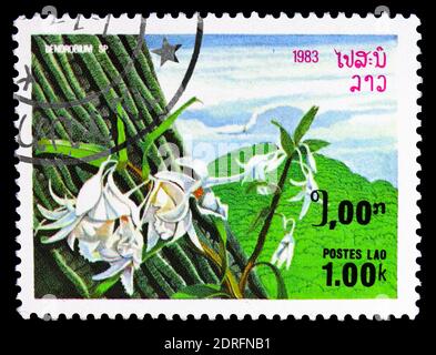 MOSKAU, RUSSLAND - 9. FEBRUAR 2019: Eine in Laos gedruckte Briefmarke zeigt Dendrobium sp., Flora Serie, um 1983 Stockfoto