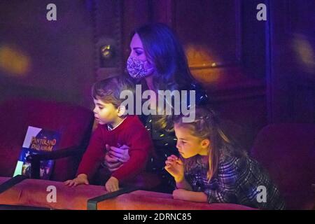 File photo dated 11/12/2020 of the Duchess of Cambridge with Prince Louis and Princess Charlotte attending a special pantomime Performance at London's Palladium Theatre, hosted by the National Lottery, to thank key Workers and their families for their oughts throughout the Pandemie. Stockfoto