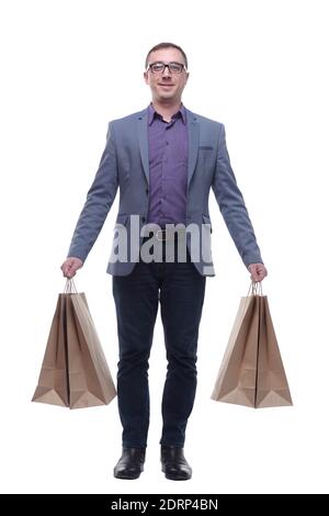 Gut aussehender junger Mann, der Einkaufstaschen hält Stockfoto