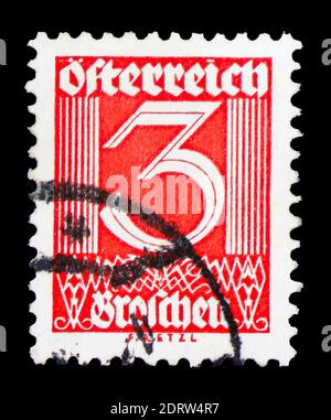 MOSKAU, RUSSLAND - 10. FEBRUAR 2019: Eine in Österreich gedruckte Briefmarke zeigt Ziffern, Zahlenreihe, um 1925 Stockfoto