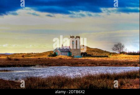 Haus und Turm am Snook auf der Heiligen Insel. Stockfoto