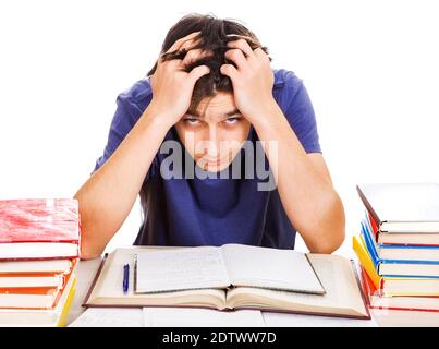 Troubled Student with a Books on the Desk on the Weißer Hintergrund Stockfoto