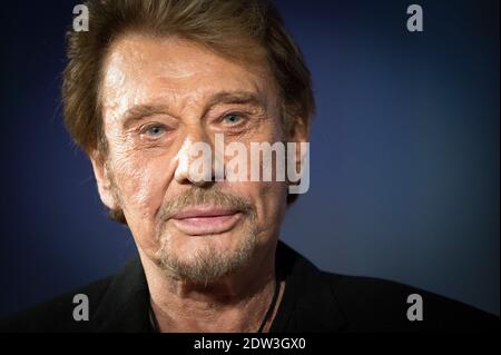 Datei Foto : Johnny Hallyday besucht am 2. April 2014 das 6. Festival International du Film Policier in Beaune, Frankreich. Frankreichs größter Rockstar Johnny Hallyday ist an Lungenkrebs gestorben, sagt seine Frau. Er war 74 Jahre alt. Der Sänger - richtiger Name Jean-Philippe Smet - verkaufte etwa 100 Millionen Platten und spielte in einer Reihe von Filmen. Foto von Nicolas Gouhier/ABACAPRESS.COM Stockfoto