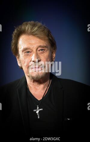 Datei Foto : Johnny Hallyday besucht am 2. April 2014 das 6. Festival International du Film Policier in Beaune, Frankreich. Frankreichs größter Rockstar Johnny Hallyday ist an Lungenkrebs gestorben, sagt seine Frau. Er war 74 Jahre alt. Der Sänger - richtiger Name Jean-Philippe Smet - verkaufte etwa 100 Millionen Platten und spielte in einer Reihe von Filmen. Foto von Nicolas Gouhier/ABACAPRESS.COM Stockfoto