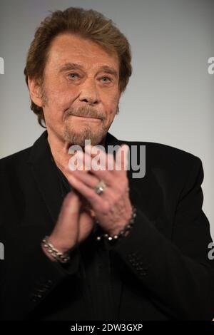 Datei Foto : Johnny Hallyday besucht am 2. April 2014 das 6. Festival International du Film Policier in Beaune, Frankreich. Frankreichs größter Rockstar Johnny Hallyday ist an Lungenkrebs gestorben, sagt seine Frau. Er war 74 Jahre alt. Der Sänger - richtiger Name Jean-Philippe Smet - verkaufte etwa 100 Millionen Platten und spielte in einer Reihe von Filmen. Foto von Nicolas Gouhier/ABACAPRESS.COM Stockfoto