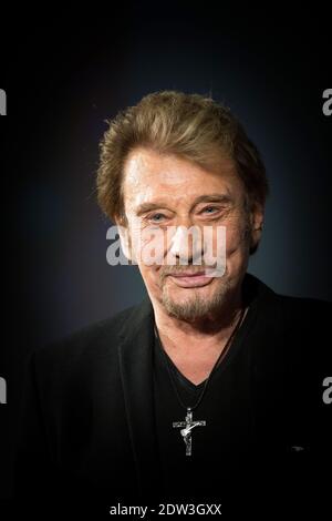 Datei Foto : Johnny Hallyday besucht am 2. April 2014 das 6. Festival International du Film Policier in Beaune, Frankreich. Frankreichs größter Rockstar Johnny Hallyday ist an Lungenkrebs gestorben, sagt seine Frau. Er war 74 Jahre alt. Der Sänger - richtiger Name Jean-Philippe Smet - verkaufte etwa 100 Millionen Platten und spielte in einer Reihe von Filmen. Foto von Nicolas Gouhier/ABACAPRESS.COM Stockfoto