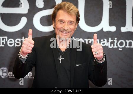 Datei Foto : Johnny Hallyday besucht am 2. April 2014 das 6. Festival International du Film Policier in Beaune, Frankreich. Frankreichs größter Rockstar Johnny Hallyday ist an Lungenkrebs gestorben, sagt seine Frau. Er war 74 Jahre alt. Der Sänger - richtiger Name Jean-Philippe Smet - verkaufte etwa 100 Millionen Platten und spielte in einer Reihe von Filmen. Foto von Nicolas Gouhier/ABACAPRESS.COM Stockfoto