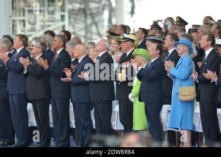 Willem-Alexander ; Bronislaw Komorowki, Präsident von Polen ; Barack Obama, Präsident der Vereinigten Staaten von Amerika ; Giorgio Napolitano, Präsident von Italien ; Ivan Gasparovic, Präsident der Slowakischen Republik ; HM der König von Norwegen, Harald V ; HM die britische Königin Elizabeth II ; Francois Hollande, Präsident von Frankreich; HM die Königin von Dänemark nehmen an der internationalen Zeremonie am Sword Beach in Ouistreham Teil, als Teil der offiziellen Zeremonien anlässlich des D-Day 70. Jahrestag, am 6. Juni 2014 in der Normandie, Frankreich. Foto von Abd Rabbo-Bernard-Gouhier-Mousse/ABACAPRESS.COM Stockfoto