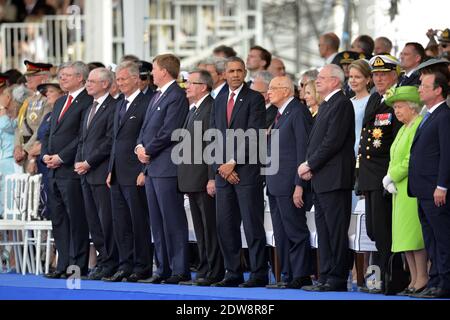 Stephen Harper, Premierminister von Kanada ; Herman Van Rompuy ; HM der König von Belgien, Philippe ; HM der König der Niederlande, Willem-Alexander ; Bronislaw Komorowki, Präsident von Polen ; Barack Obama, Präsident der Vereinigten Staaten von Amerika ; Giorgio Napolitano, Präsident von Italien ; Ivan Gasparovic, Präsident der Slowakischen Republik; HM der König von Norwegen, Harald V; HM die britische Königin Elizabeth II; Francois Hollande nimmt an der internationalen Zeremonie am Sword Beach in Ouistreham Teil, als Teil der offiziellen Zeremonien anlässlich des 70. Jahrestages des D-Day am 6. Juni 2014 in Norm Stockfoto