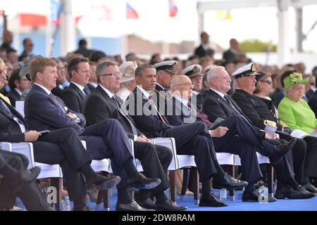 L-R : König Willem-Alexander von den Niederlanden, Präsident von Polen Bronislaw Komorowski, Präsident der Vereinigten Staaten von Amerika Barack Obama, Präsident der Slowakischen Republik Ivan Gasparovic, König Harald V. von Norwegen, Großherzogin Maria-Teresa von Luxemburg, britische Königin Elisabeth II, Nehmen Sie an der internationalen Zeremonie am Sword Beach in Ouistreham Teil, die im Rahmen der offiziellen Feierlichkeiten anlässlich des 70. Jahrestages des D-Day am 6. Juni 2014 in der Normandie, Frankreich, stattfindet. Foto von Abd Rabbo-Bernard-Gouhier-Mousse/ABACAPRESS.COM Stockfoto