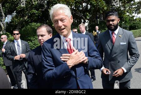 Der ehemalige US-Präsident Bill Clinton kümmert sich um die Verpfändung des AmeriCorps auf dem South Lawn des Weißen Hauses am 12. September 2014 in Washington, DC. Die Zeremonie markiert den 20. Jahrestag des nationalen Dienstleistungsprogramms, das vom ehemaligen US-Präsidenten Bill Clinton ins Leben gerufen wurde.Foto: Olivier Douliery/ABACAPRESS.COM Stockfoto