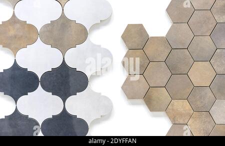 Keramikfliesen in Form einer Wabe und im orientalischen Stil an einer weißen Wand. Stockfoto