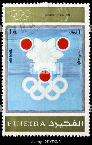 MOSKAU, RUSSLAND - 23. MÄRZ 2019: Briefmarke gedruckt in Vereinigte Arabische Emirate, Fujairah, zeigt Grenoble 1968, Olympische Winterspiele 1924-1972, Werbung Stockfoto