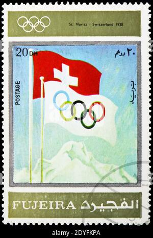 MOSKAU, RUSSLAND - 23. MÄRZ 2019: Briefmarke gedruckt in Vereinigte Arabische Emirate, Fujairah, zeigt St.Moritz 1928, Olympische Winterspiele 1924-1972, Werbung Stockfoto