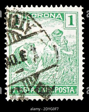 MOSKAU, RUSSLAND - 19. JULI 2019: Briefmarke gedruckt in Ungarn zeigt Reaper, Serie, um 1922 Stockfoto