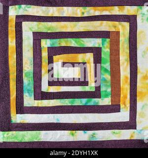 Textil-Hintergrund - genäht Detail Patchwork-Stoff mit gelb Spiralmuster Stockfoto