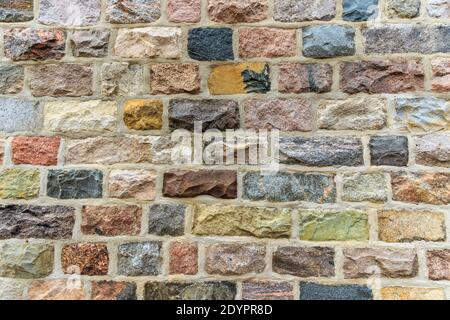 Mehrfarbige Ziegelwand für Hintergrund. Stockfoto