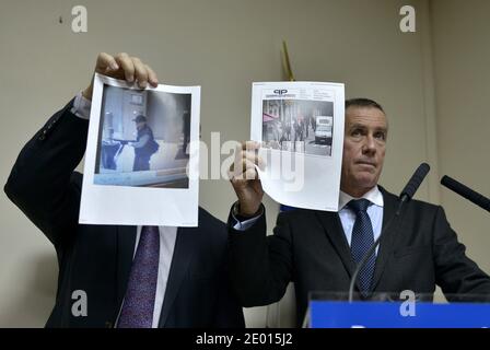 Der französische Staatsanwalt Francois Molins und der Direktor der Pariser Justizpolizei Christian Flaesch bei einer Pressekonferenz, auf der ein Bild des Schützen gezeigt wird, der in der Lobby des französischen Zeitungsbüros Liberation das Feuer eröffnete, Er verletzte einen Assistenten des Fotografen ernsthaft und eröffnete das Feuer vor dem Vorstadthauptsitz der Societe Generale im Geschäftsviertel La Defense, bevor er am 18. November 2013 ein Auto entnahm, um ihn zur Champs-Elysees Avenue zu bringen, heute in Paris, Frankreich. Foto von Mousse/ABACAPRESS.COM Stockfoto